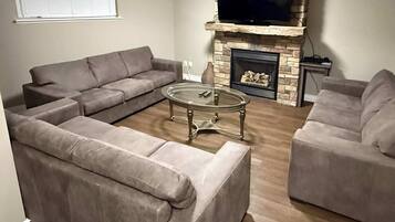 Flat-screen TV, fireplace, video game console, Netflix