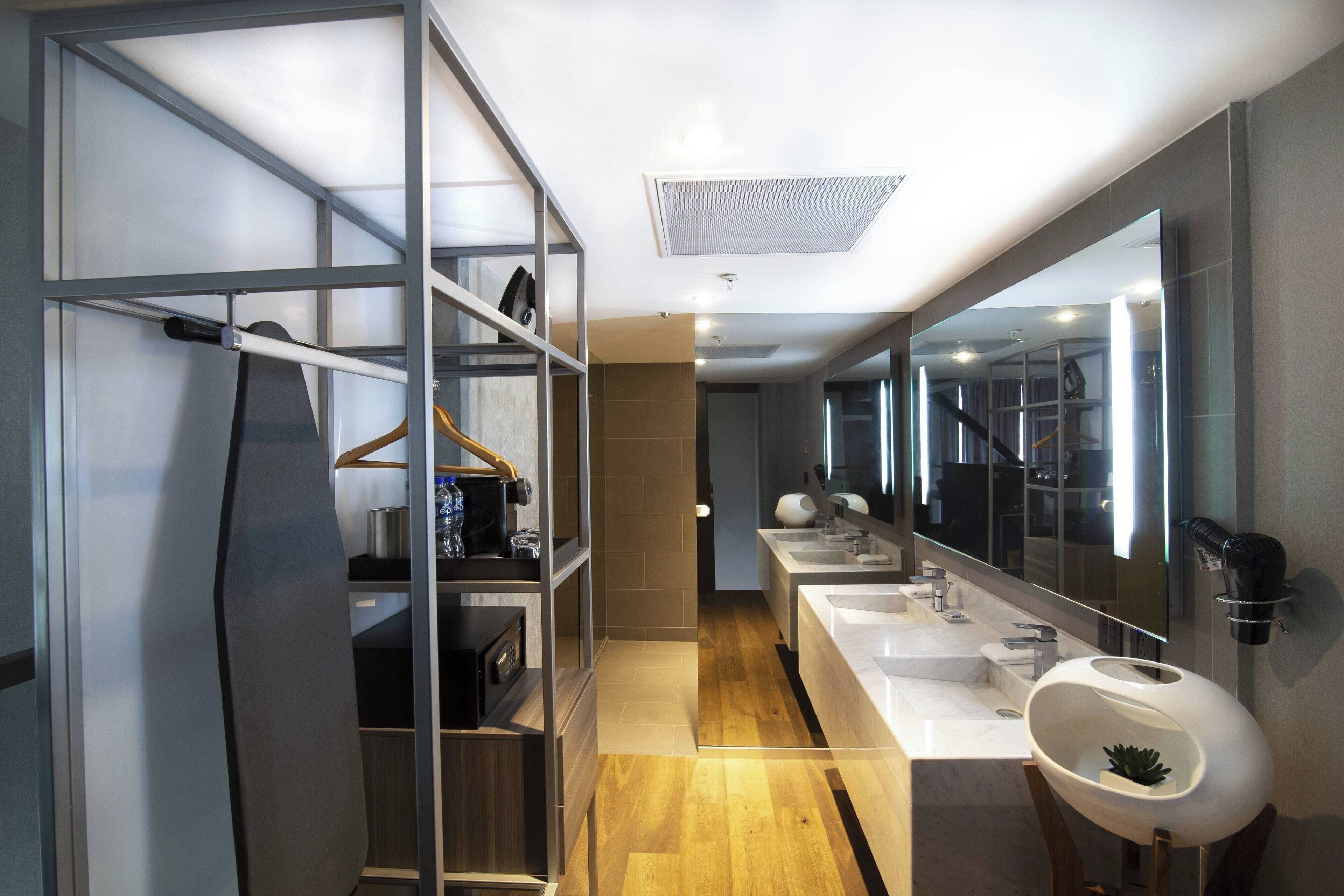 suite, 1 king bed, non smoking (bi-level) | bathroom | shower, free toiletries, hair dryer, towels