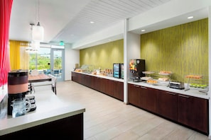 A modern breakfast bar with a coffee machine, a water dispenser, and a variety of food items. - Springhill Suites San Diego Mission Valley (San Diego)