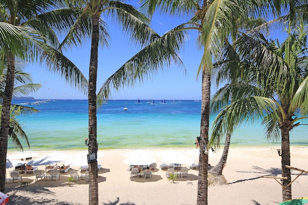 On the beach, white sand, sun loungers