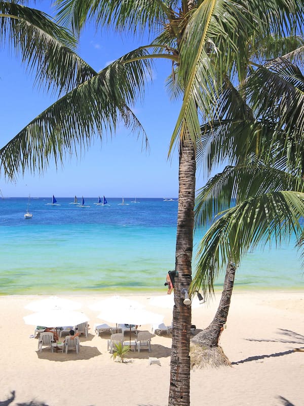 On the beach, white sand, sun-loungers
