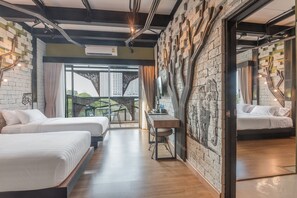 A modern hotel room with two beds, a dining table, and a view of a cityscape. - Sea Crest By Jomtien (Pattaya)