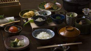 A traditional Japanese meal setup with various dishes and utensils.