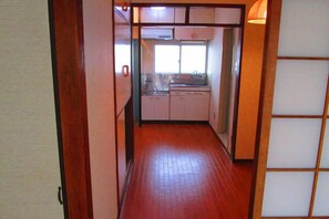 Apartment (403, see email for self check in) | Private kitchenette | Full-sized fridge, microwave, stovetop, cookware/dishes/utensils - Takano Apartment (Tokyo)