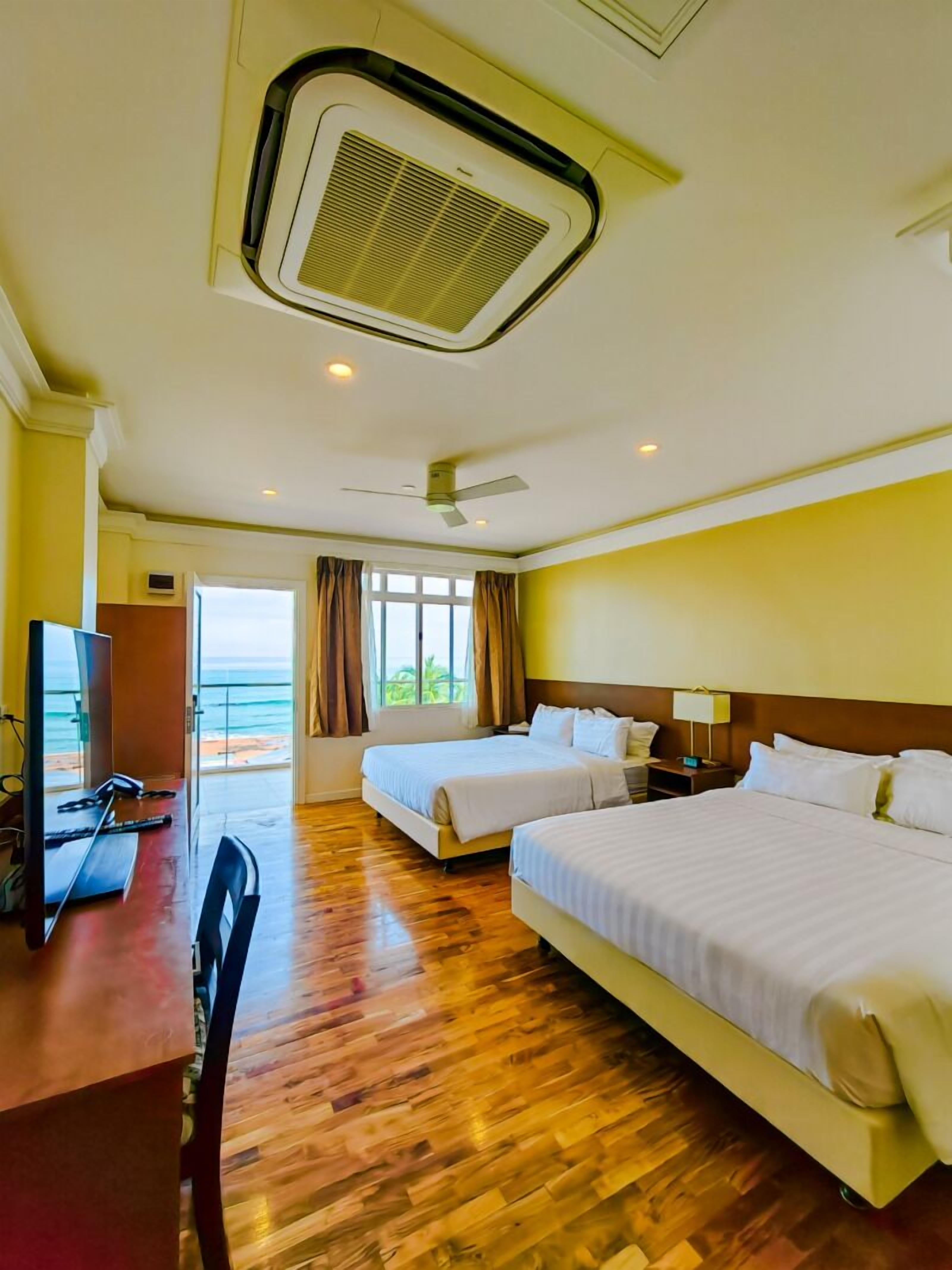superior deluxe room, 2 queen beds, non smoking, beach view | hypo-allergenic bedding, minibar, in-room safe, desk