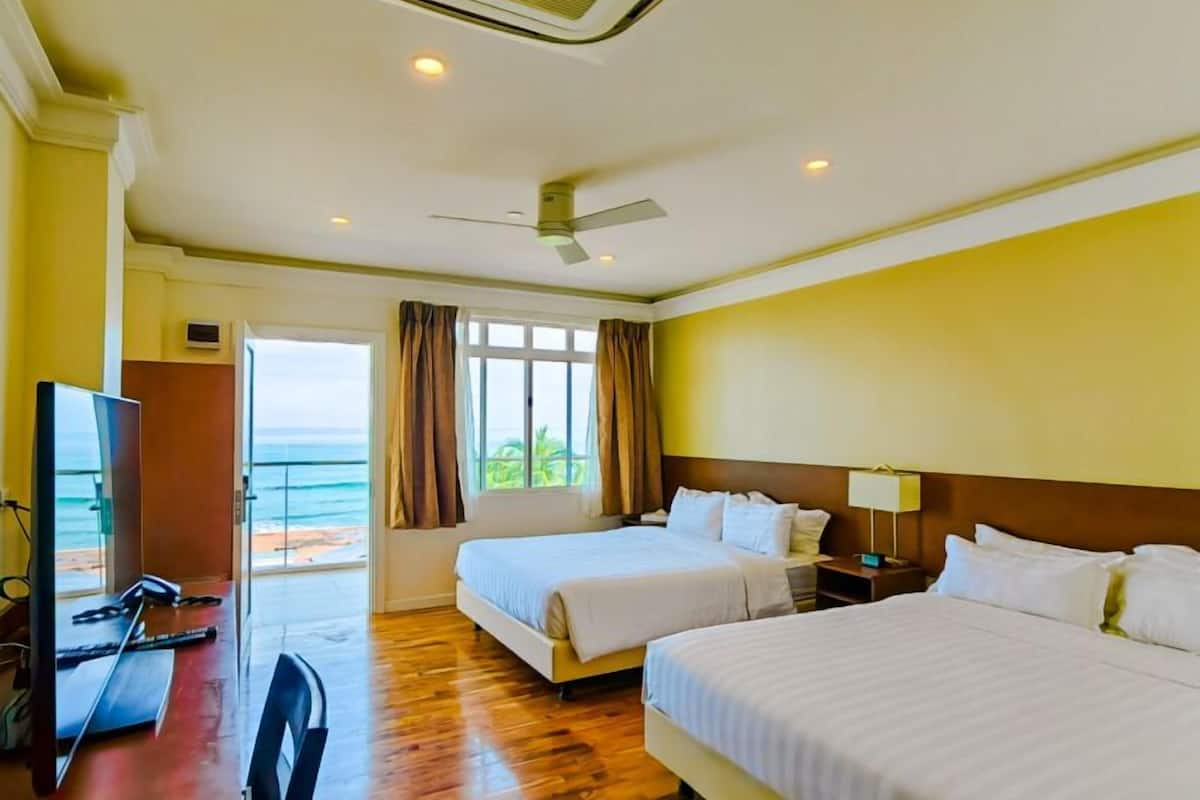 superior deluxe room, 2 queen beds, non smoking, beach view | hypo-allergenic bedding, minibar, in-room safe, desk