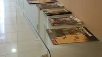 A glass display table with magazines.