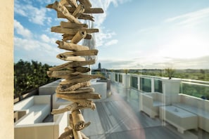 Relax in a semi-circular seating area with a clear view of the surrounding landscape.