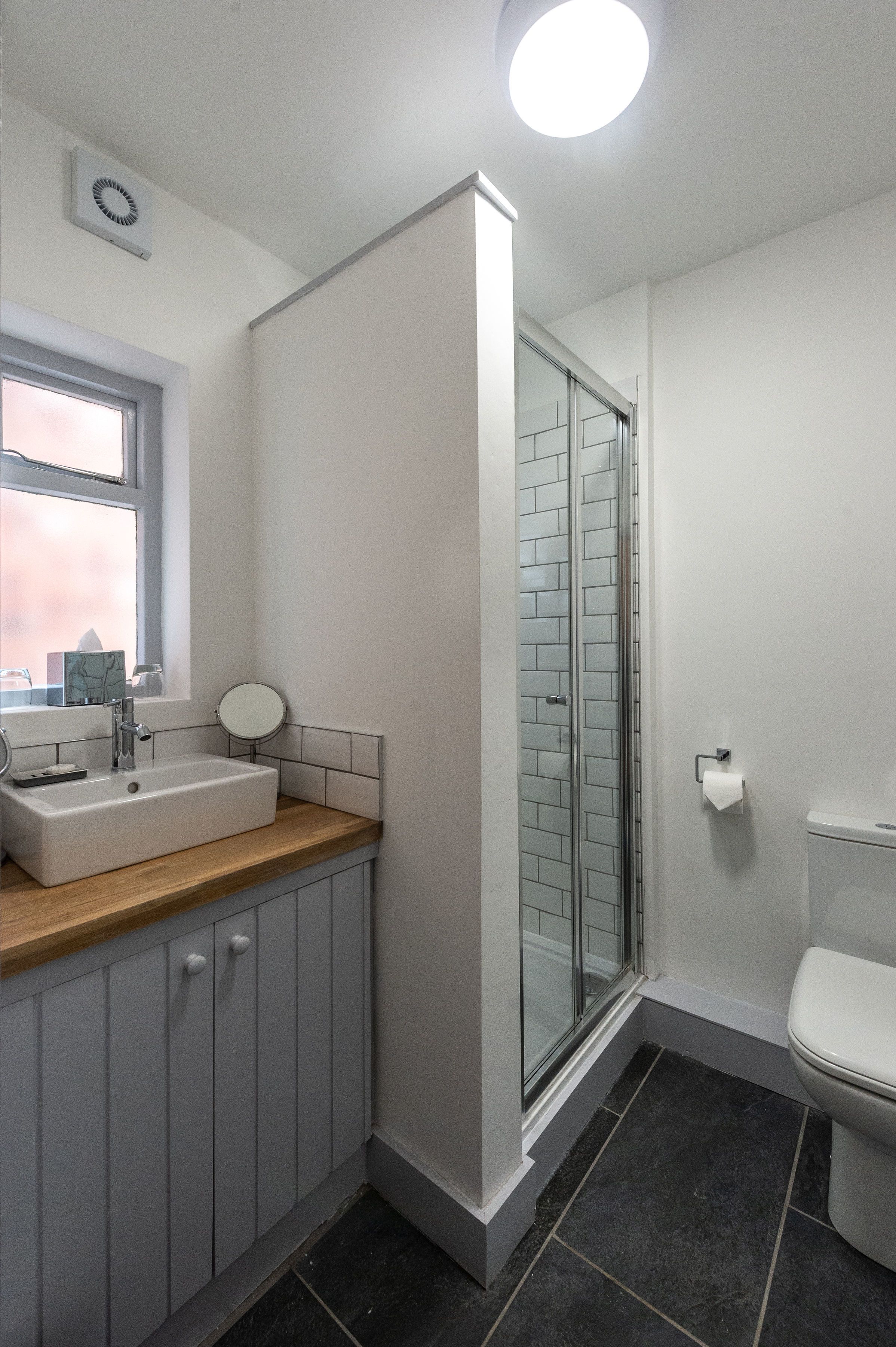 classic studio, 1 king bed, refrigerator | bathroom | free toiletries, hair dryer, towels