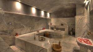 A luxurious bathroom with marble walls, a freestanding bathtub, and a shower area. - The Fourteen Luxury Boutique Hotel & Spa (Casablanca)