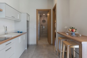 Suite Junior, 1 chambre, vue jardin | Cuisine privée