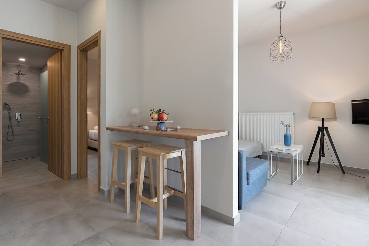 Junior Suite, 1 Bedroom, Garden View | In-room safe, soundproofing, iron/ironing board, free cribs/infant beds