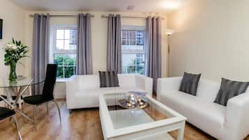 Apartment, 2 Bedrooms (4 Adults) | Living room | 20-inch TV with cable channels