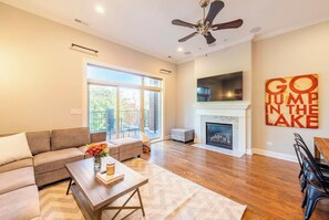 Luxury Condo | Living area | 50-inch LCD TV with cable channels, TV - The Sono Chicago (Chicago)