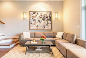 Luxury Condo | Living area | 50-inch LCD TV with cable channels, TV - The Sono Chicago (Chicago)