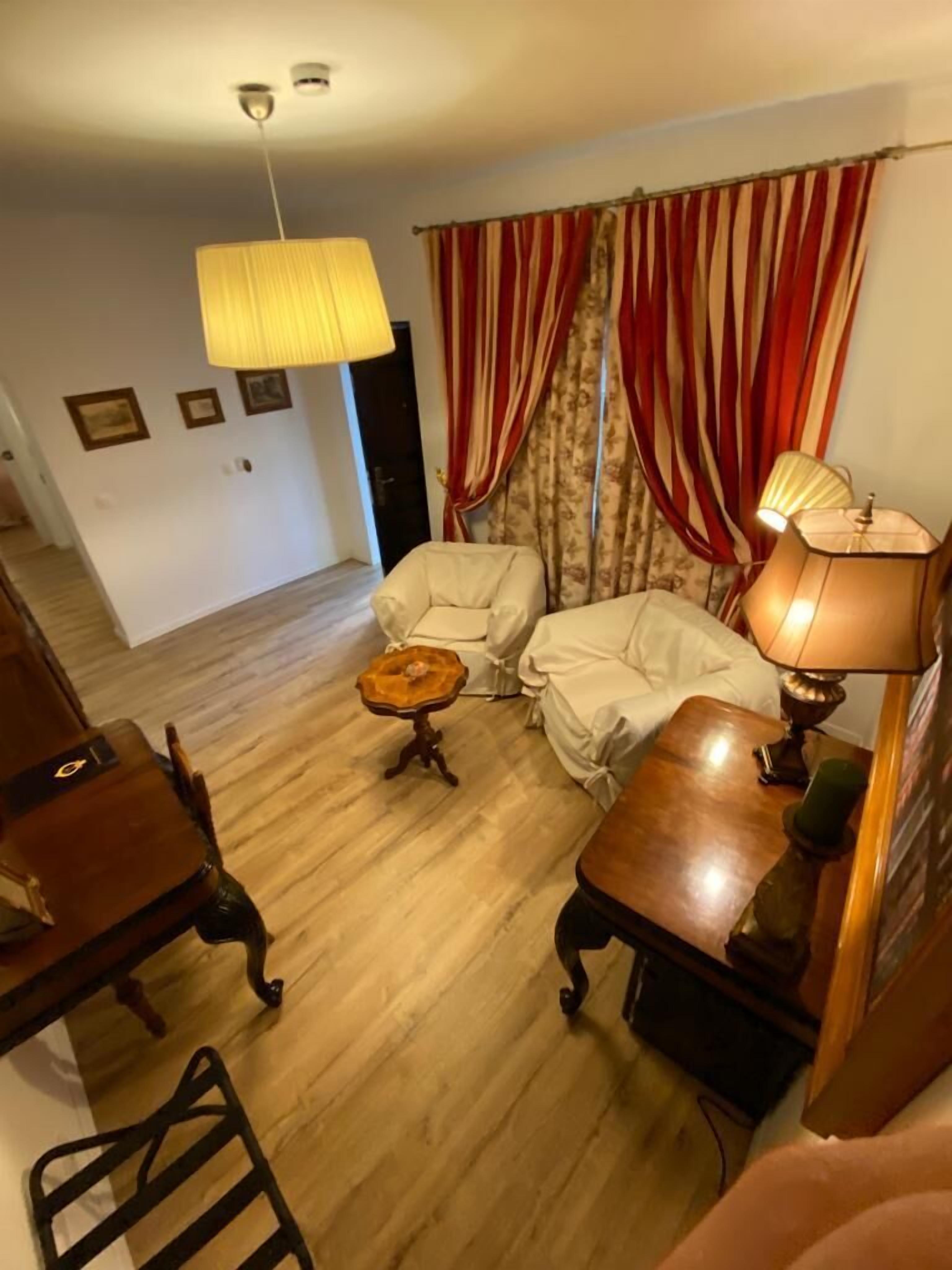 comfort villa (3 meters from main building) | living area | flat-screen tv, books
