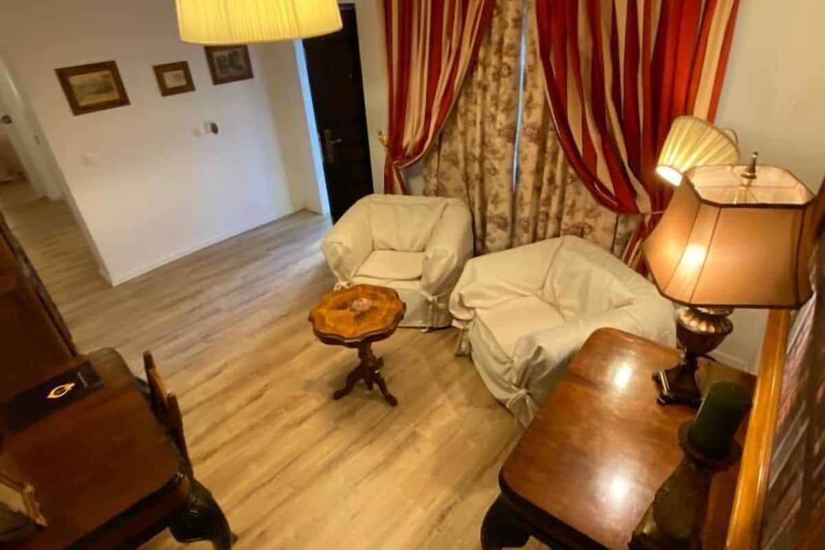 comfort villa (3 meters from main building) | living area | flat-screen tv, books