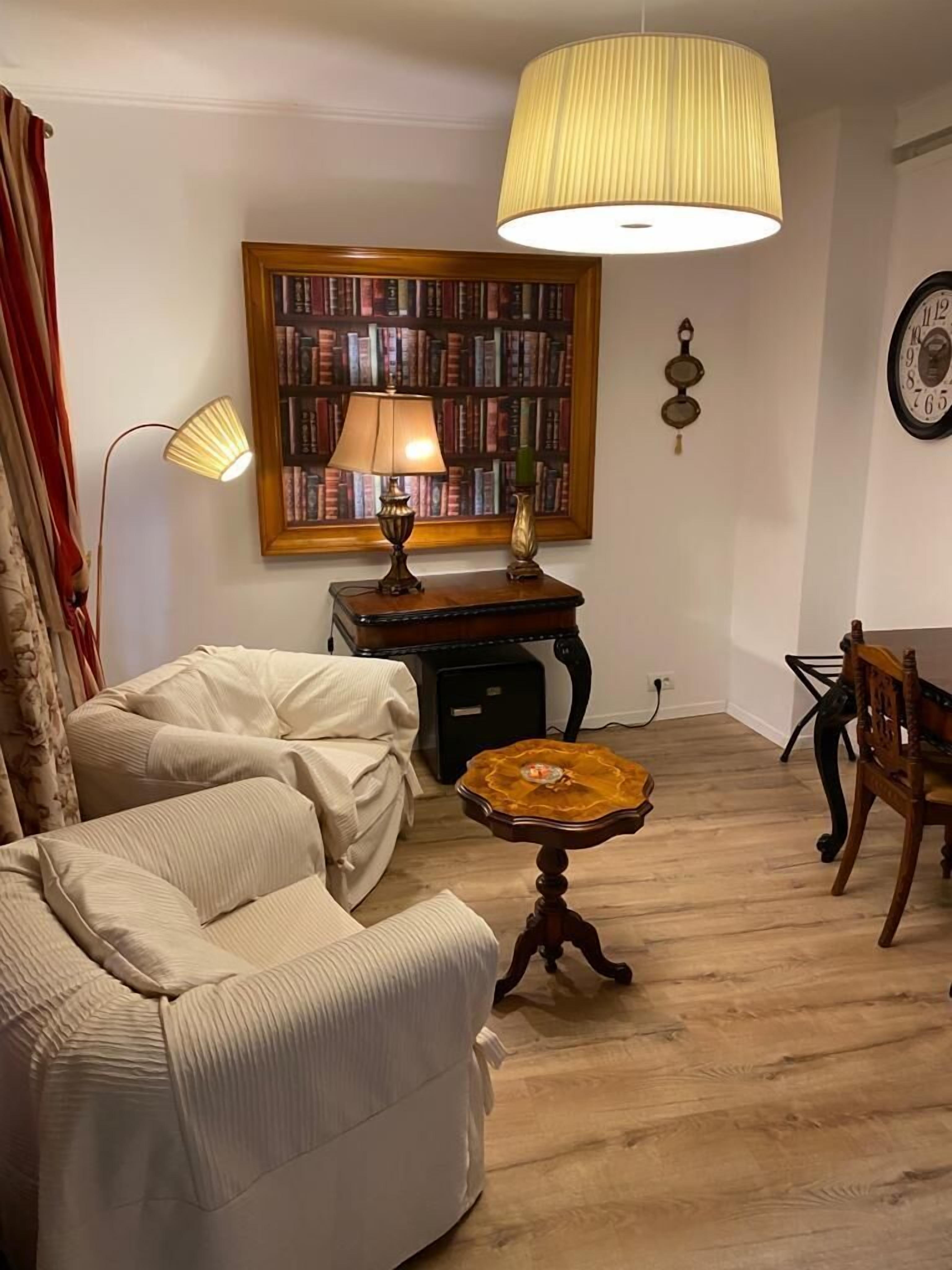 comfort villa (3 meters from main building) | living area | flat-screen tv, books