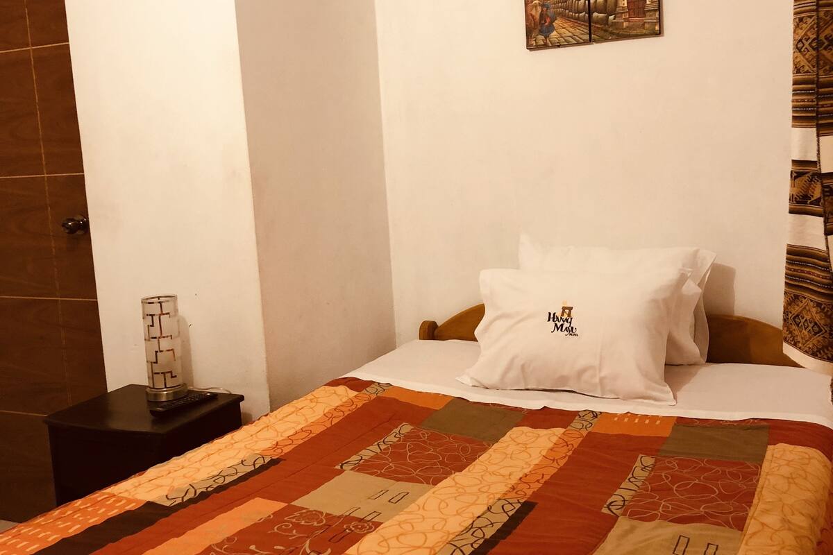 Basic Single Room, 1 Bedroom | Living area | Flat-screen TV