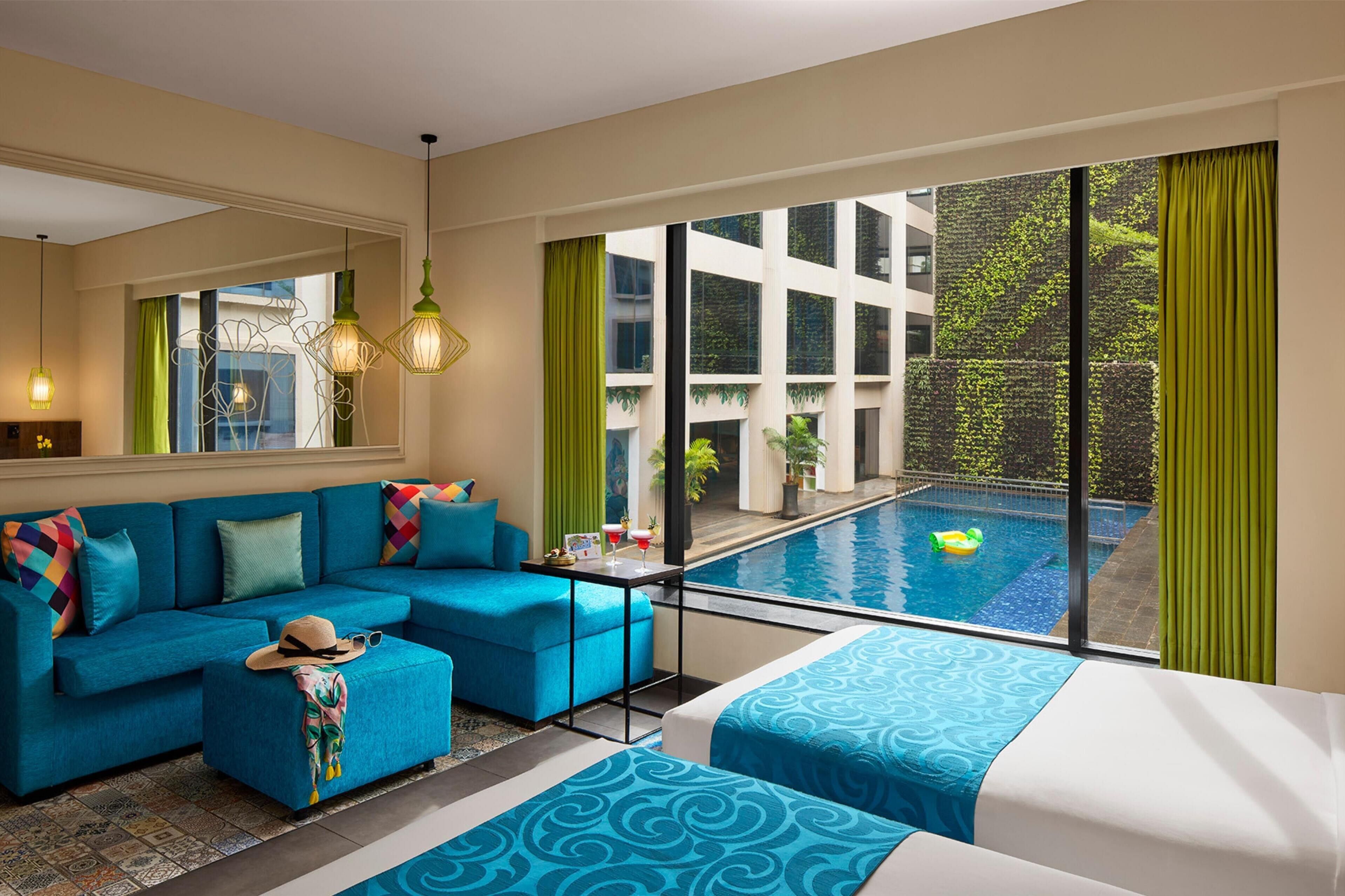 room, pool view (2 twin beds and 1 sofa bed) | premium bedding, in-room safe, desk, laptop workspace