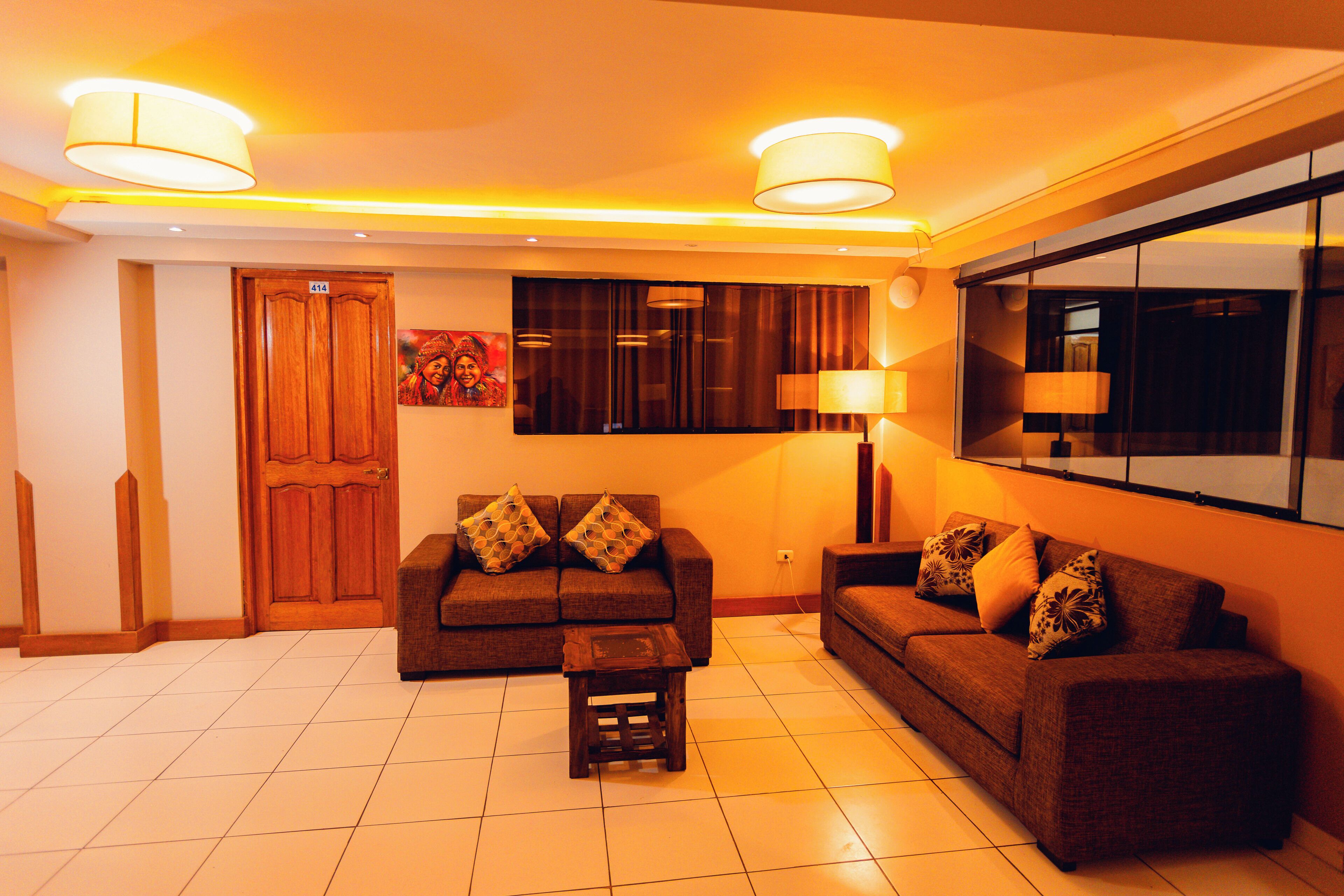 A living room with two sofas, a coffee table, and two lamps.