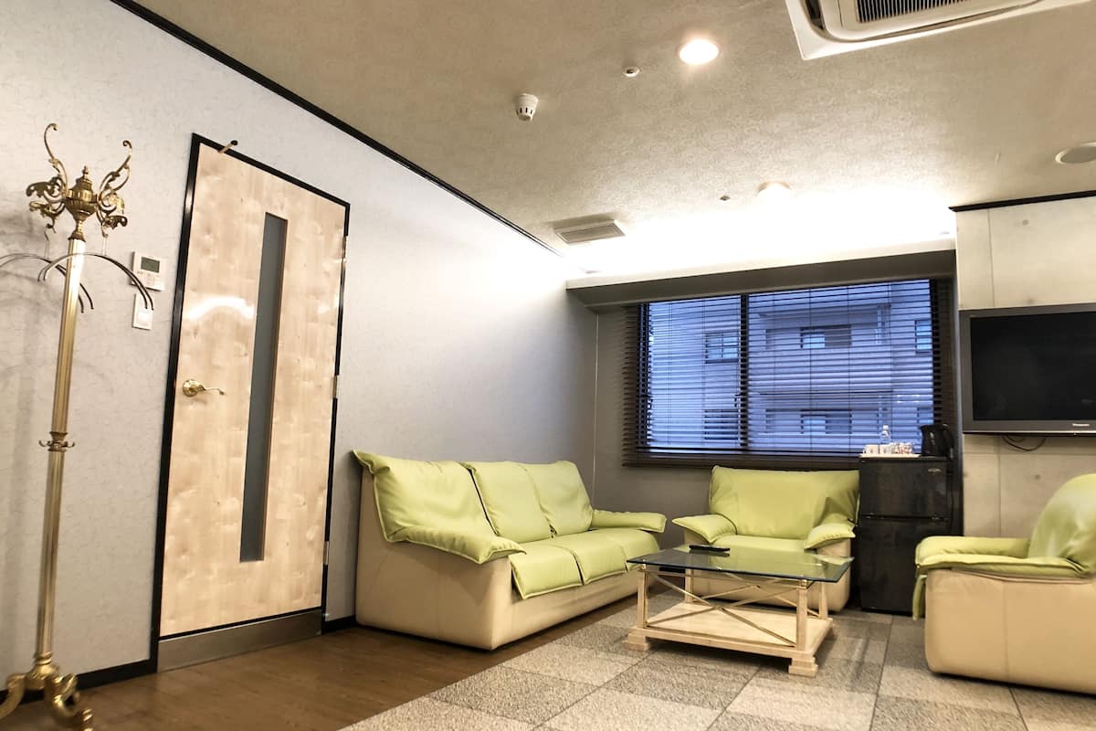 Suite room, Non Smoking | Living area | 50-inch flat-screen TV with cable channels, TV, toys