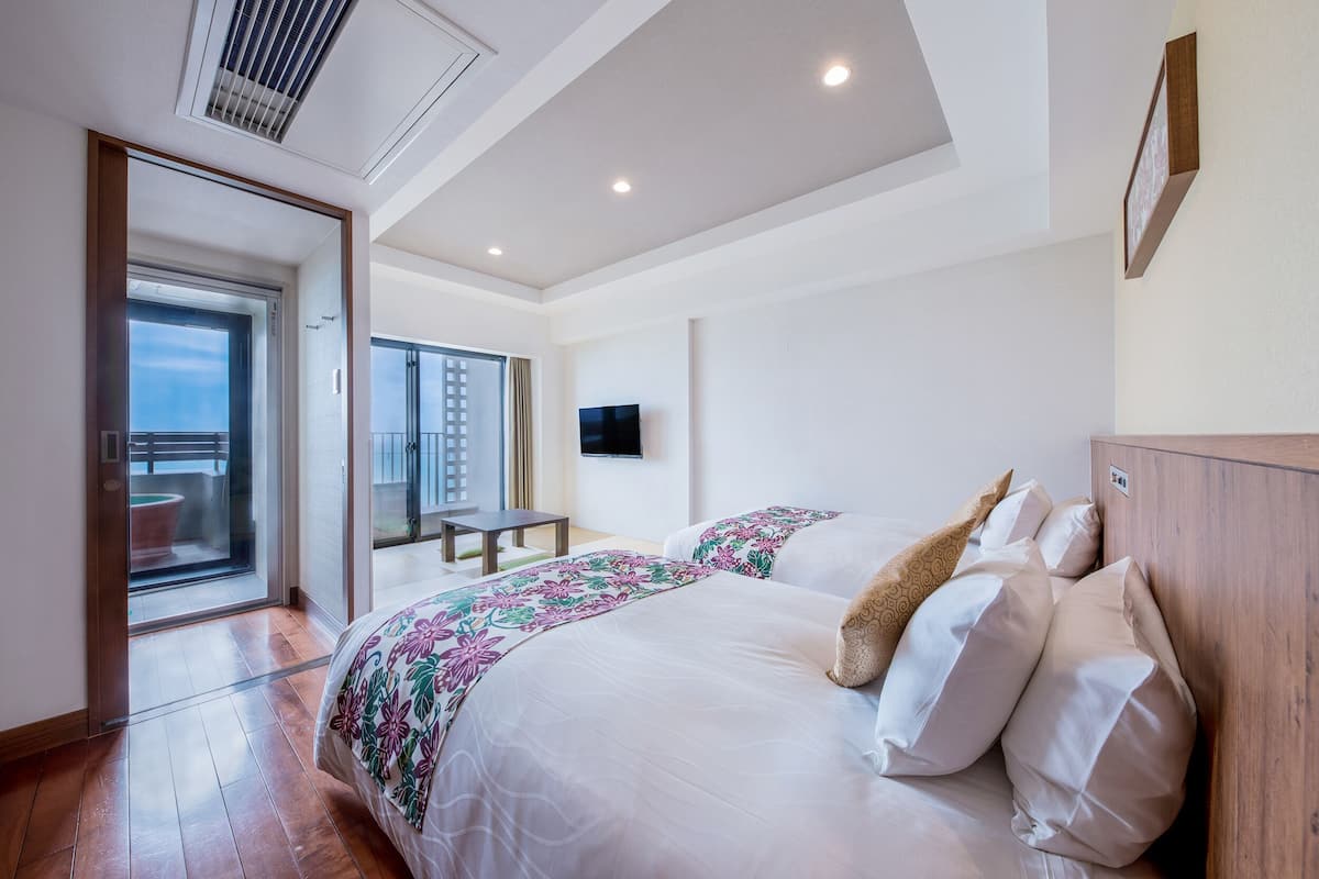 Private open-air Onsen bath / Twin Room with Tatami Area/ Ocean View | Down comforters, in-room safe, desk, blackout drapes