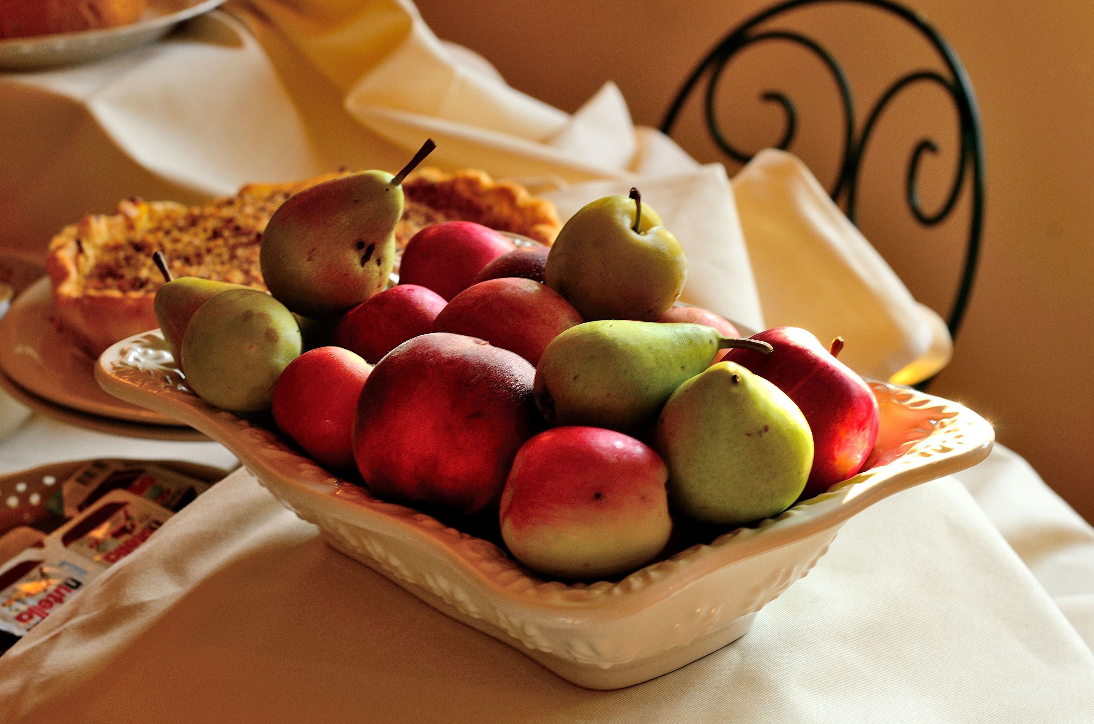 A bowl of fruit on a table.