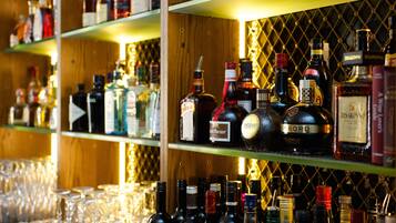 Shelves stocked with various liquor bottles and glasses.