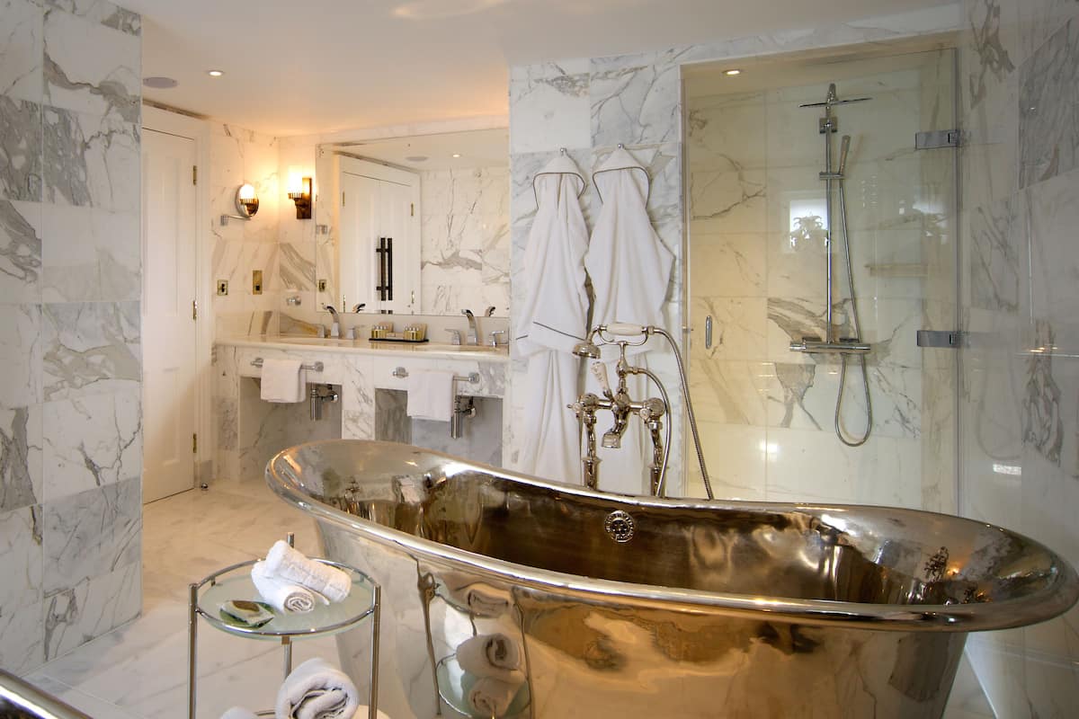 signature suite | bathroom | free toiletries, hair dryer, bathrobes, slippers