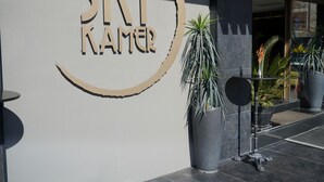 A hotel sign with the name "SKY Namer" and a circular design element. - Sky Kamer Hotel (Antalya)
