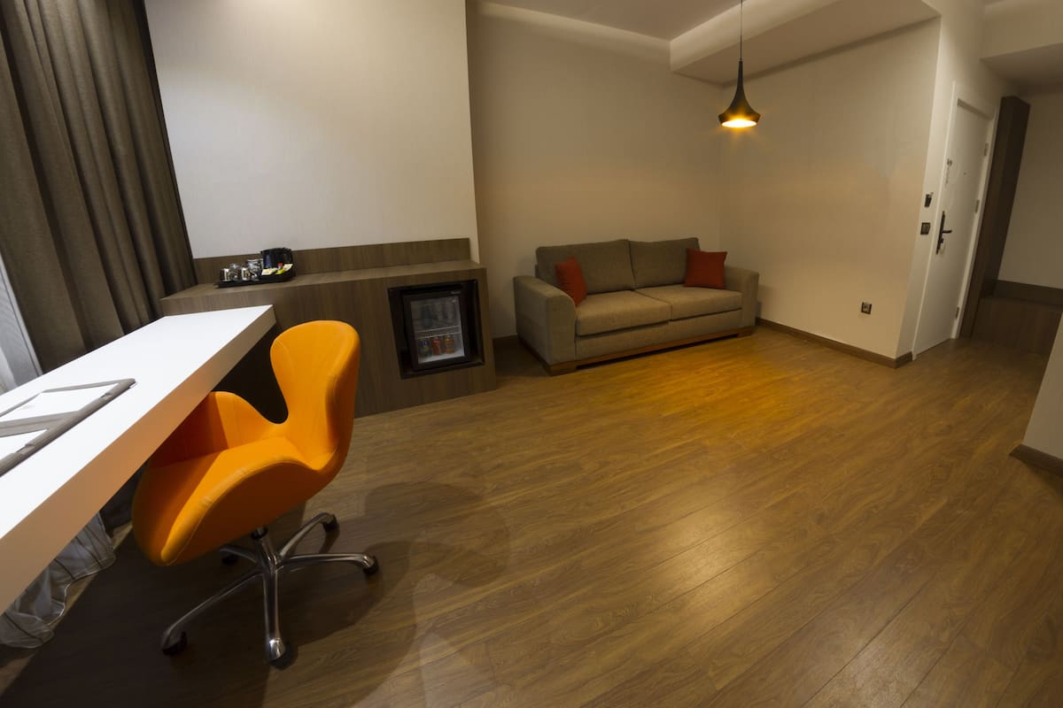 Suite, Corner | Minibar, in-room safe, desk, iron/ironing board