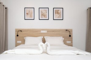 Deluxe Quadruple Room, Garden View | Minibar, in-room safe, desk, laptop workspace - Nala Island Village (Maafushi)