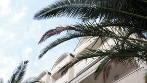 A building with a curved facade and balconies.