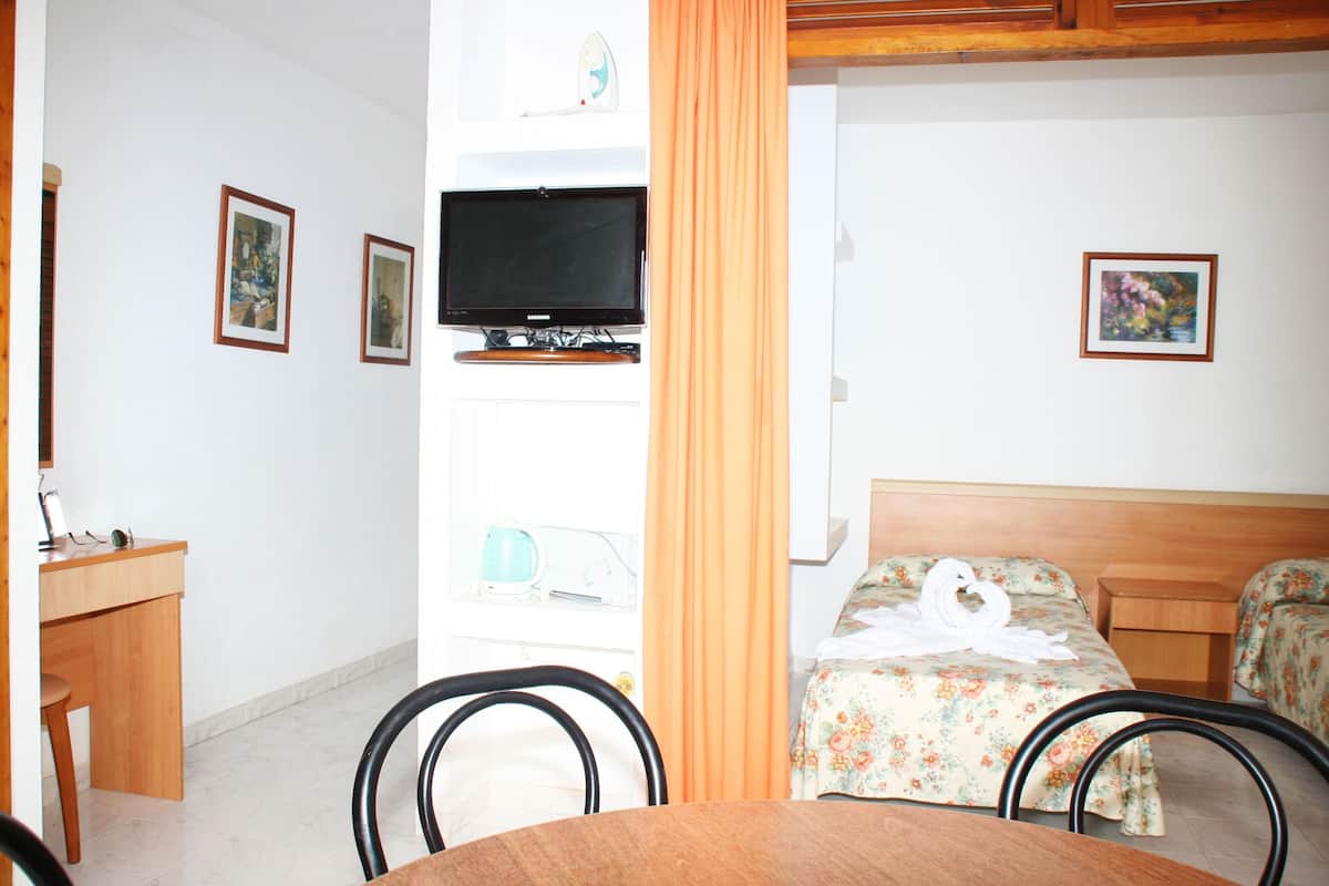 Down comforters, iron/ironing board, cribs/infant beds, bed sheets