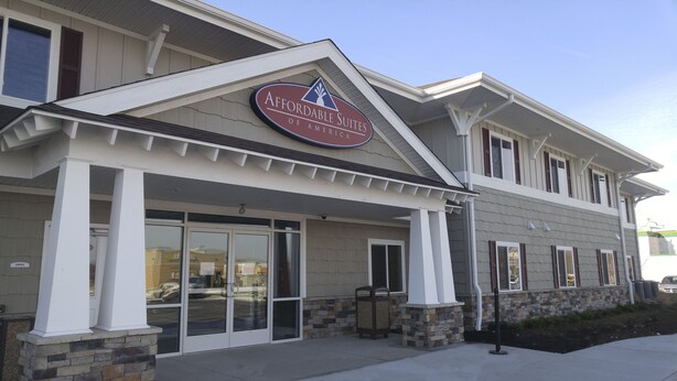 A building with a sign reading "Affordable Suites of America."