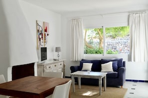 Suite, Terrace | Living room | Flat-screen TV, fireplace - Hacienda Encanto del Rio (Santa Eulalia del Rio)