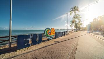 A beachfront promenade with a sign reading "EUROPA IMAGES".