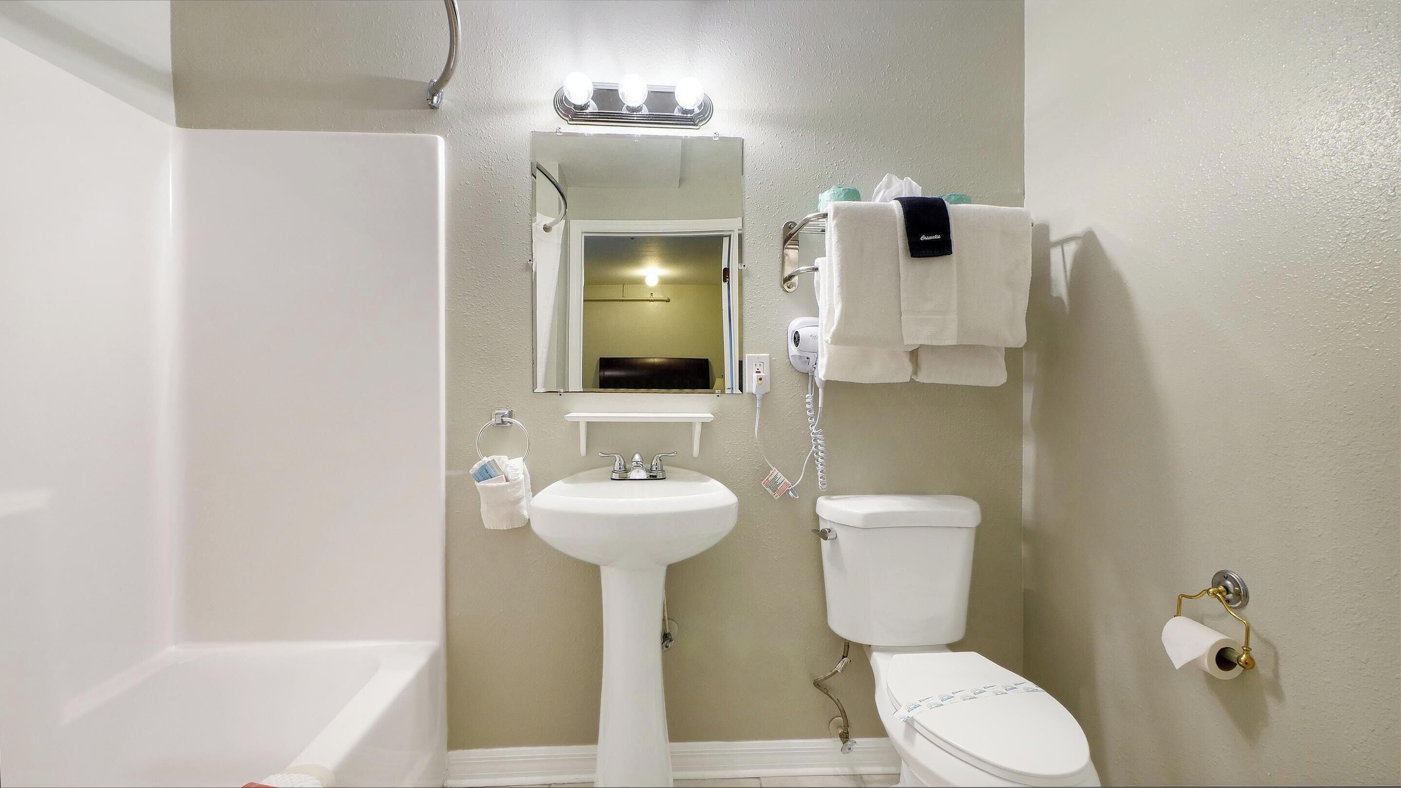 classic room, 2 queen beds | bathroom | combined shower/bathtub, free toiletries, hair dryer, towels
