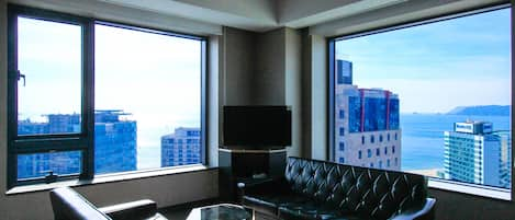 Suite, Ocean View | Living area | 40-inch flat-screen TV with satellite channels, TV