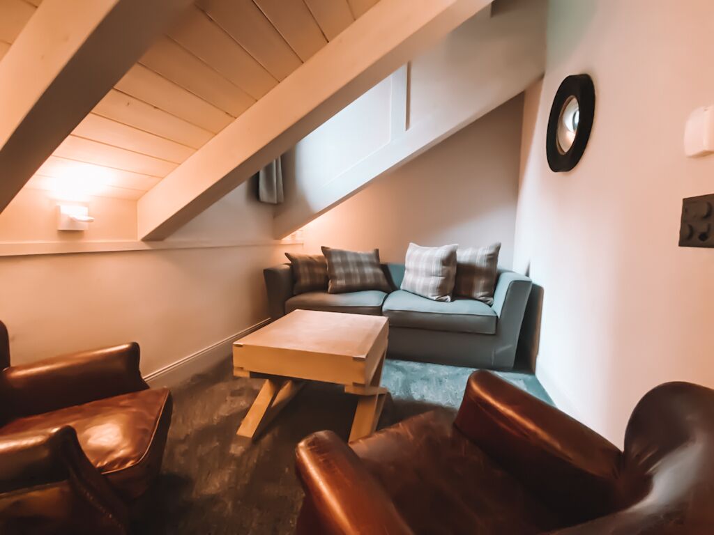 junior suite | living area | 70-cm flat-screen tv with cable channels, tv, heated floors