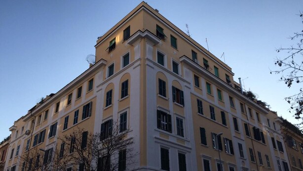 A multi-story building with a symmetrical facade, large windows, and a flat roof. - Andrea Doria Resort (Rome)