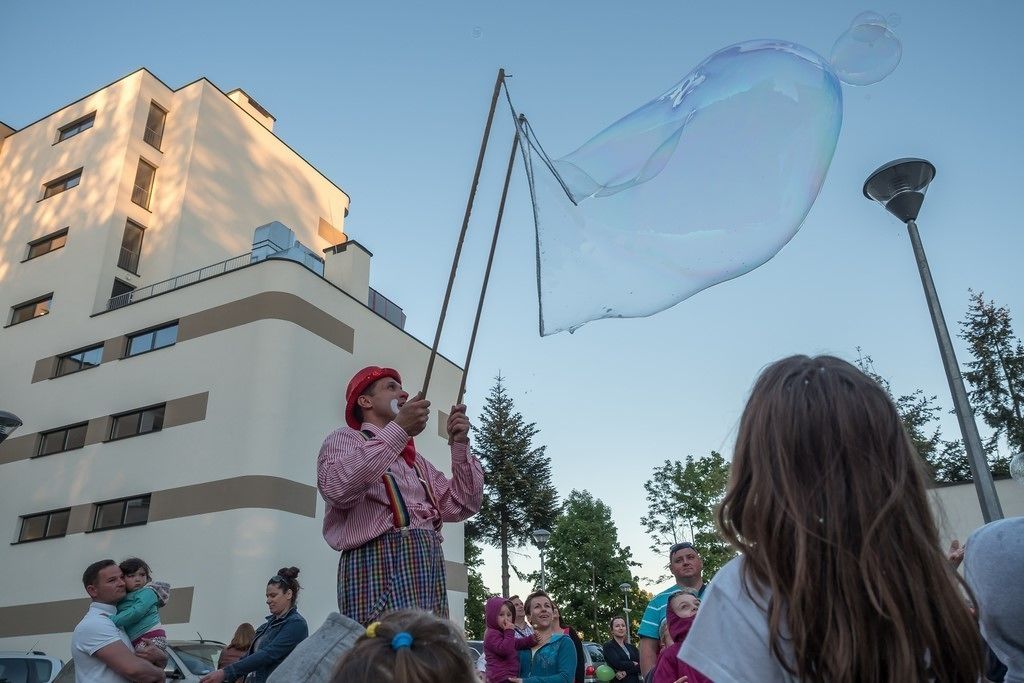 A person performing with a large bubble.