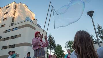 A person performing with a large bubble.