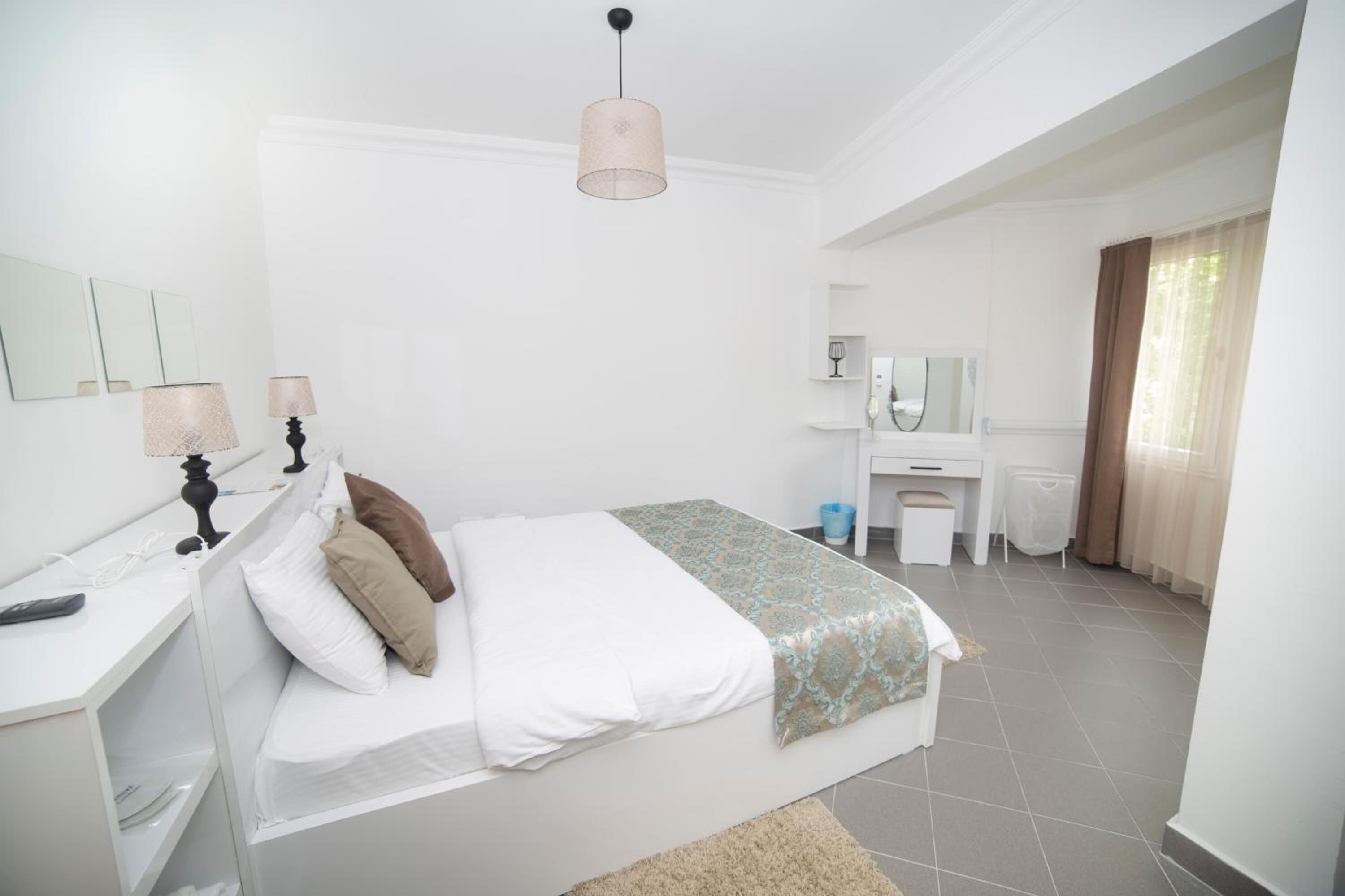 one bedroom suite with kitchen with old town view | premium bedding, laptop workspace, soundproofing, iron/ironing board
