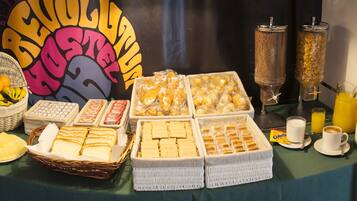 A breakfast buffet with various food items and beverages.