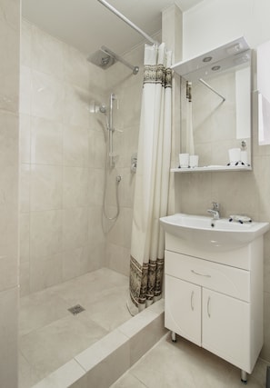 Shower, free toiletries, hair dryer, slippers