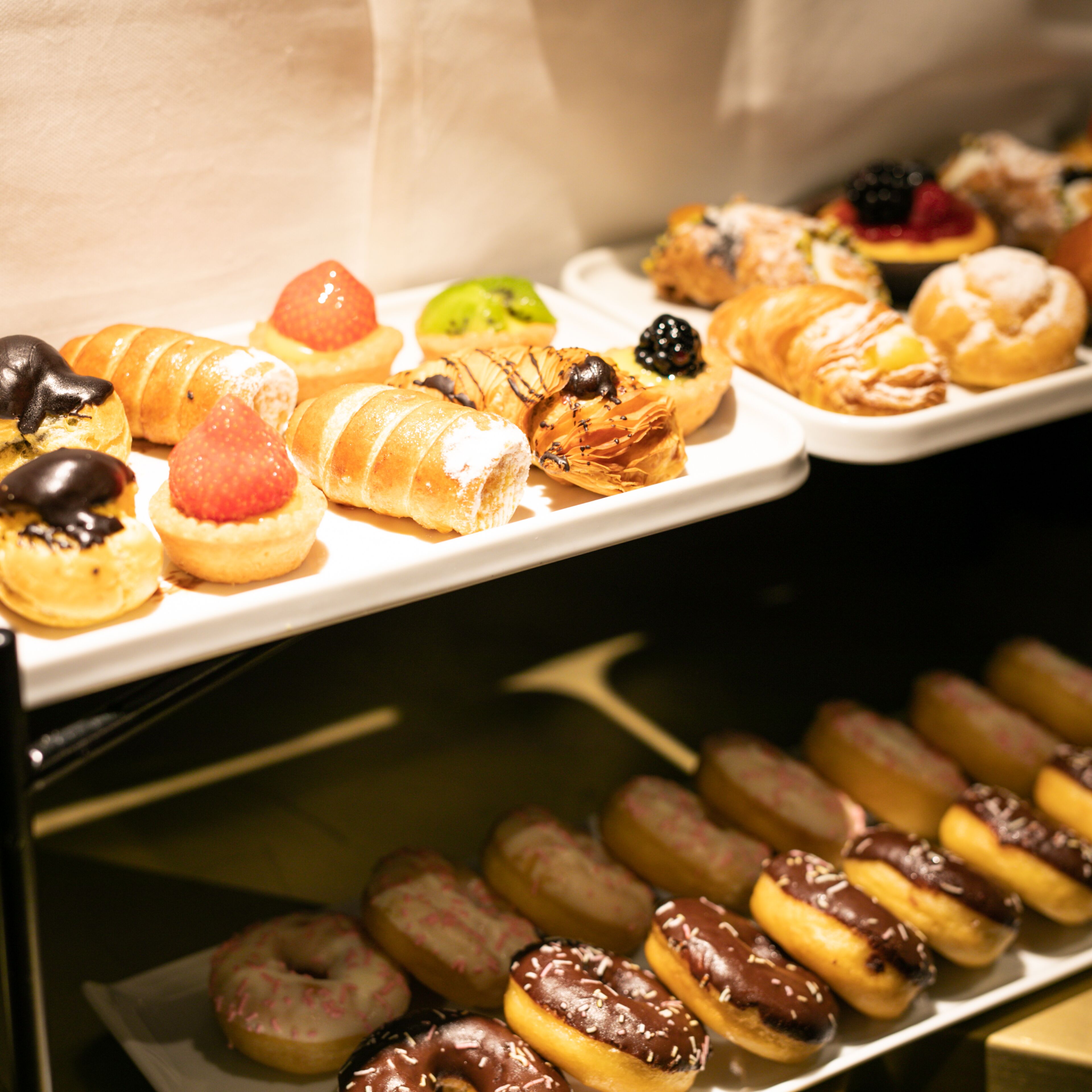 A variety of pastries and desserts on display.