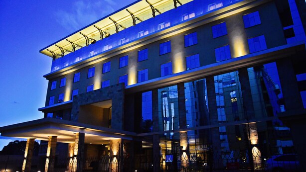 A multi-story hotel with a flat roof, large windows, and a covered entrance area. - DoubleTree by Hilton Nairobi Hurlingham (Nairobi)