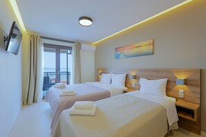 Triple Room, Sea View | Memory foam beds, in-room safe, desk, soundproofing - Sunset Hotel (Aristotelis)